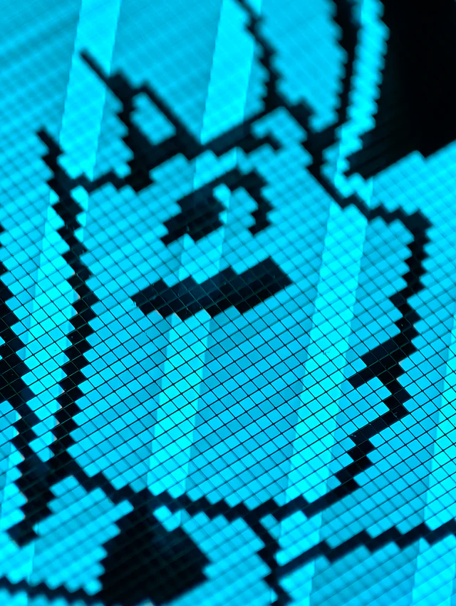 Extreme macro photograph of cyan pixel cells forming a character on the transparent OLED.